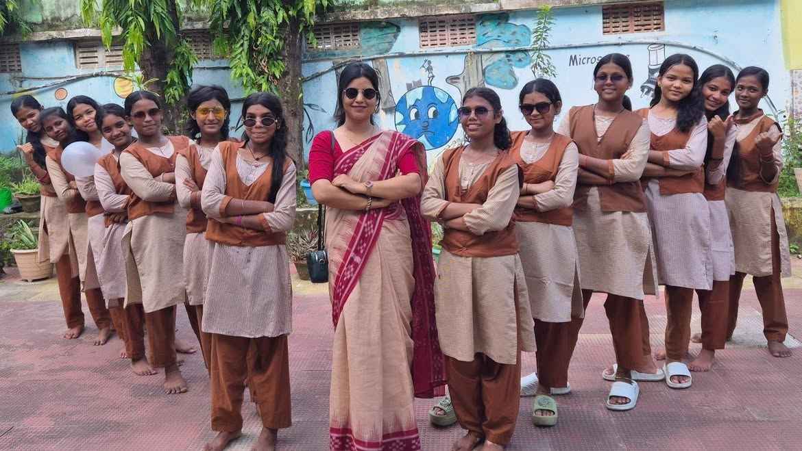 Teacher with girl students